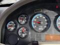 Dashboard of a 2010 International 4300 with various gauges including speedometer oil temperature water temperature and RPM scale
