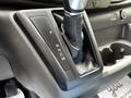 Gear shifter of a 2022 Ford Transit showing the positions for park reverse neutral drive and manual