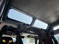 The interior of a 2006 Emergency One Fire Truck featuring overhead windows a dashboard area with vents and seats designed for emergency responders