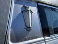 Close-up of a silver emblem on a 2013 Lincoln MKT featuring a lantern design with the word "Federal" and the name "Stratford" below it
