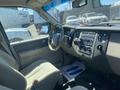 Interior view of a 2013 Ford Expedition showcasing the dashboard steering wheel and seats
