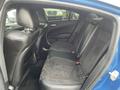 Interior view of a 2022 Dodge Charger showing the backseat with black leather and suede upholstery