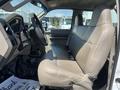 Interior view of a 2008 Ford F-450 SD showing a beige front seat and dashboard with steering wheel and controls visible