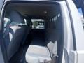 Interior view of a 2016 Ford F-350 SD showing the back seat area with gray fabric seats and headrests
