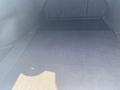 The trunk area of a 2017 Acura TLX featuring a flat black carpeted surface and no visible items inside