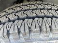 Close-up of a worn tire tread from a 2012 Chevrolet Express showing distinct patterns and grooves