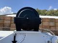 A close-up view of a black winch mounted on a 2023 Ford F-550 with an angle indicator visible at the bottom