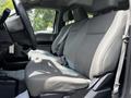 Front seat interior of a 2017 Ford F-250 SD featuring gray fabric upholstery with ample seating space and a simple dashboard design