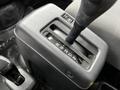 Close-up of a gear shift lever with markings for reverse neutral drive and two lower gears in a 2020 Hino 338