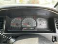 Dashboard of a 2003 Mitsubishi Delica displaying speedometer fuel gauge and odometer with a reading of 15555 km