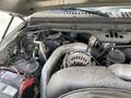 A close-up view of the engine compartment of a 2007 Ford F-350 SD showcasing the engine components and wiring