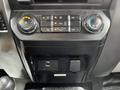 The image shows the control panel of a 2017 Ford F-550 featuring climate control knobs and a USB port