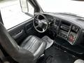 Interior view of a 2006 GMC C5000 showing the driver's seat steering wheel and dashboard controls