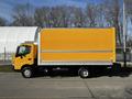 A yellow 2017 Hino 155 box truck featuring a large cargo area and single rear wheels parked on a paved surface