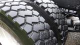 Close-up of a rugged tire from a 2019 Western Star Trucks 4900 with distinctive tread pattern designed for traction and durability