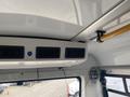 Interior view of a 2016 Chevrolet Express showing the ceiling vents and control panel mounted above the windshield