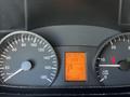 Dashboard of a 2010 Mercedes-Benz Sprinter showing speedometer odometer auxiliary gauges and a digital display with mileage and fuel information