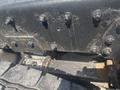 Close-up of the chassis of a 2008 Peterbilt 340 showing bolts and mechanical components with visible wear and grime