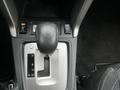 Shift lever and controls of a 2016 Subaru Forester showing gear positions P R N D and buttons for heated seats