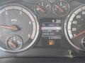 Dashboard of a 2011 Dodge Ram 5500 showing gauges for RPM fuel level and tire pressure along with a digital display for fuel economy and vehicle information