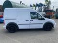 White 2013 Ford Transit Connect cargo van parked with a plain exterior and black wheels