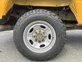A close-up of a truck tire mounted on a wheel showing the rugged tread pattern and metallic hub of a 2017 Ford F-250 SD