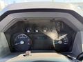 Dashboard of a 2016 Ford F-550 displaying speedometer and other gauges with a digital odometer reading 74715 km
