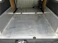 A 2016 Ford Transit Connect with a metallic floor and side panels in the cargo area, designed for utility and storage