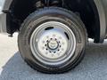 Close-up of a 2008 Ford F-550 wheel featuring a silver alloy rim with multiple spokes mounted on a black Michelin tire with visible tread pattern