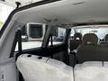 Interior view of a 2003 Mitsubishi 7 Passenger Van showing the seats and passenger space