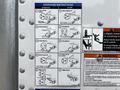 A close-up view of an instructional panel for operating a liftgate on a 2019 International 4300 showing various steps for stowing and operating the liftgate