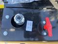 A control panel for a 2024 AGT Mini Excavator featuring an ignition switch and a red emergency stop lever