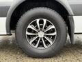 A close-up of a black and silver alloy wheel with a thick tire, featuring five narrow spokes and a central hub, part of a 2016 Mercedes-Benz Sprinter vehicle