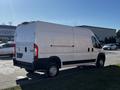 A white 2019 RAM Promaster van parked with a high cargo area and dual rear wheels