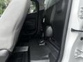 Interior view of the rear cabin space of a 2019 Chevrolet Colorado showcasing the seating area and floor detailing