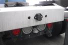 Rear view of a 2015 Kenworth T660 showing the bumper with taillights and a connection point for electrical wiring
