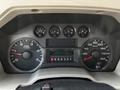 The dashboard of a 2008 Ford F-550 showing gauges for speed fuel level and engine RPM with a digital display for trip information
