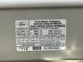 2010 Ford Econoline vehicle emission control information label showing fuel type and other specifications related to the vehicle's engine and capacity