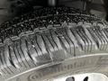 Close-up of a Continental tire with deep treads showcasing good grip and minimal wear on a 2023 Ford Transit