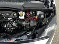 A 2016 Ford Transit Connect engine compartment showing the engine, battery, and various components with visible wires and connectors
