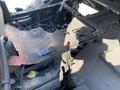 A close-up view of the engine compartment of a 2018 Kubota RTV-X 1100 C showing metal components and wiring