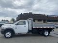 A 2011 Dodge Ram 5500 work truck with a flatbed and side toolboxes in white exterior color