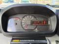The dashboard of a 2014 Hino 195 displaying speedometer fuel gauge and warning lights