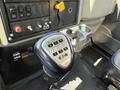 Close-up of a gear shift knob in a 2009 International 7500 truck with numeric gear patterns and an Eaton label