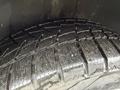 Close-up of a tire from a 2017 Dodge Grand Caravan showcasing its tread pattern designed for traction and performance