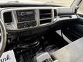 Interior view of a 2017 Hino 338 with dashboard controls and seat upholstery visible
