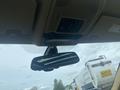 Interior view of a 2009 BMW X5 showing the rearview mirror and overhead controls
