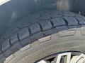 Close-up of a tire from a 2019 Mercedes-Benz Sprinter showing tread pattern and details of the rubber surface