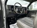 Interior of a 2006 GMC C5000 showing the steering wheel dashboard and driver's seat with controls and gauges visible