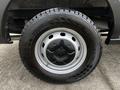 A close-up view of a black tire mounted on a silver alloy wheel belonging to a 2020 Ford Transit